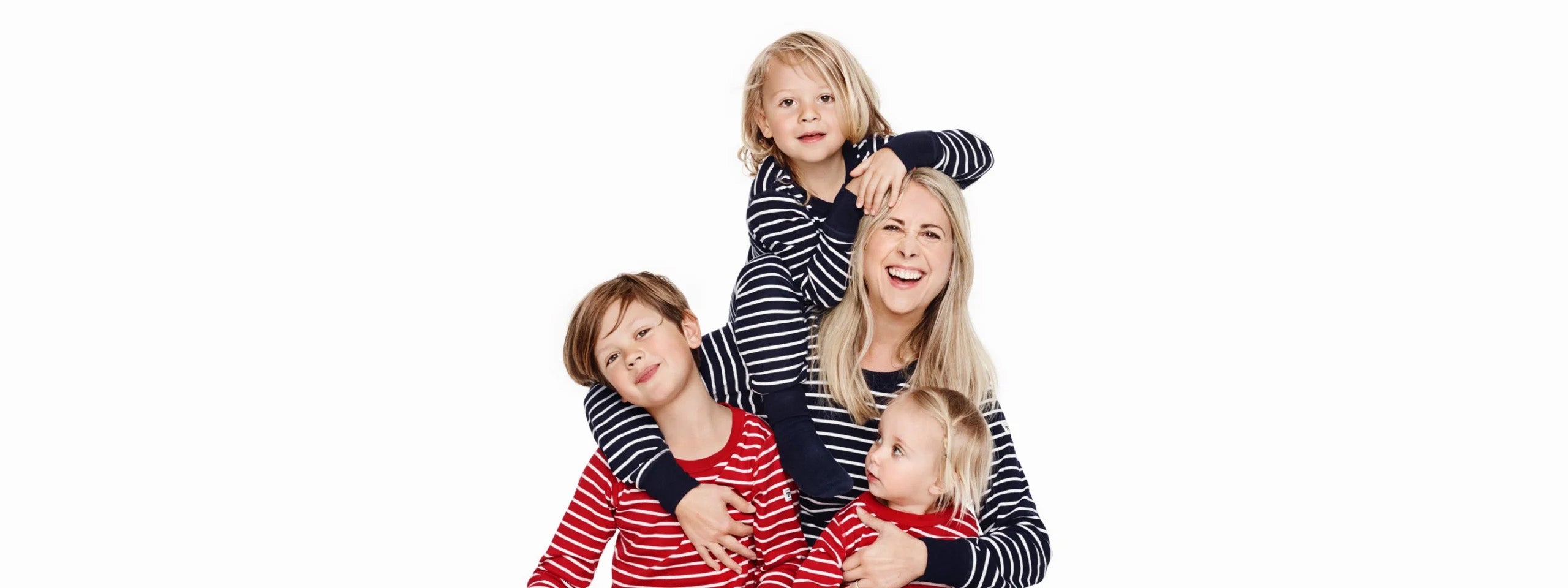 Adult model and three children, all in striped shirts 